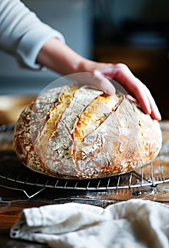Artisan Baker Holding Freshly Baked Sourdough Bread in a Rustic Kitchen