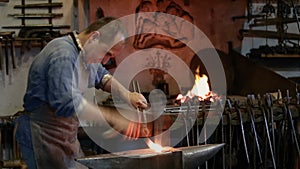 Artisan blacksmith working in the forge