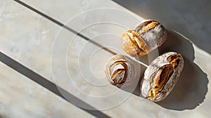 Artisan bread loaves on textured surface