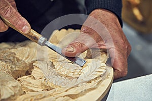 Artisan carver makes decorative panels