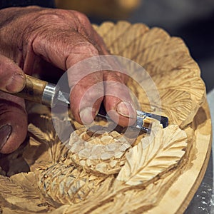 Artisan carver makes decorative panels