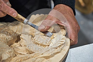 Artisan carver makes decorative panels