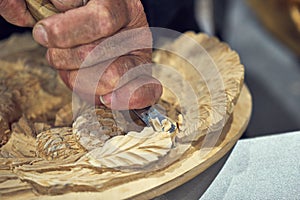 Artisan carver makes decorative panels