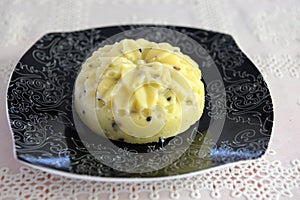 Artisan cheese with seeds in the shape of a flower