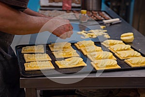 Artisan confectioner prepares homemade apple pie in a confectionery photo