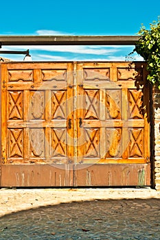 Artisan created, carved wooden gates, to secure a private winery