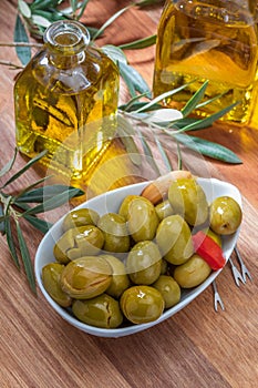 Artisan olives canned in extra virgin olive oil, vinegar, spices with red peppers and garlic.