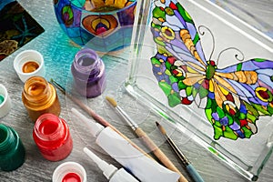 Artisan painting with stained glass paints.