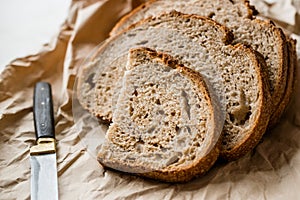 Artisan Sliced Homemade Sourdough Bread Slices with Paper Bag / Package or Craft Paper.