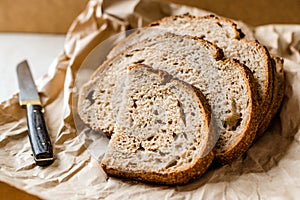 Artisan Sliced Homemade Sourdough Bread Slices with Paper Bag / Package or Craft Paper.