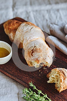 Artisan sourdough bread served with olive oil and thyme