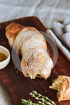 Artisan sourdough bread served with olive oil and thyme