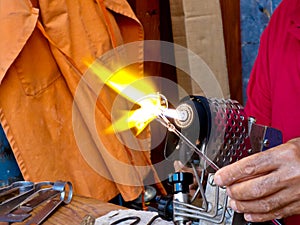 Artisan Working With Blowtorch
