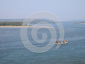 Artisanal fisheries fleet returning to port after a dayâ€™s fishing, in Goa, India