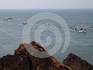 Artisanal fisheries fleet returning to port after a dayâ€™s fishing, in Goa, India