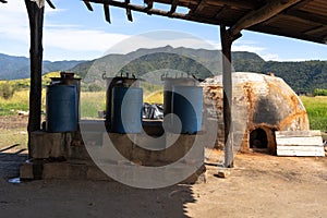 Artisanal oven and fermentation equipment in the field to make tequila and raicilla. photo