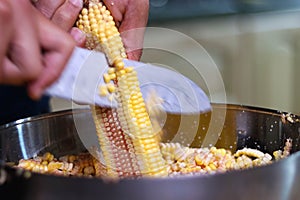 Artisanal preparation of corn cachapas, a typical Venezuelan dish.