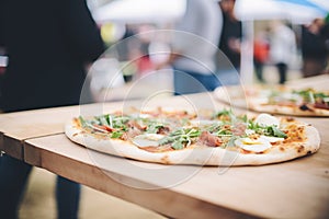 artisanal woodfired pizzas crafted at a food festival