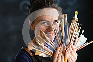 Artist art supplies woman paintbrushes tools fan