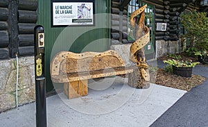 Artist bench in front of a station was a Canadian Pacific railway station in Montebello, Quebec