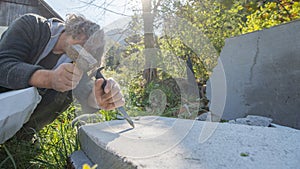 Artist carving in stone with great precision