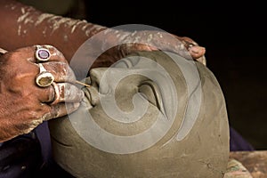 Artist creates the head of a goddess