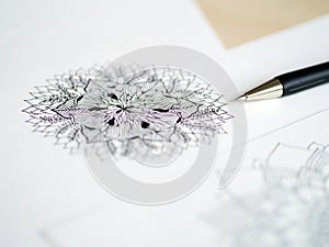 Artist desk top view pen, pencil mandala flower floral hand drawing