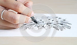 Artist desk top view pen, pencil mandala flower floral hand drawing