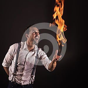 Artist with fire in his hands.