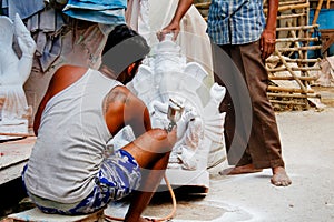 An artist giving the finishing touch of the Statue of God Ganesh. August 4, 2019 Kumartuli, Kolkata