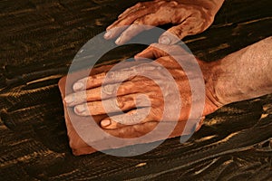 Artist man hands working red clay for handcraft