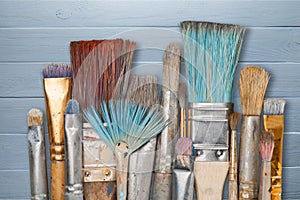 Artist paint brushes and paint cans