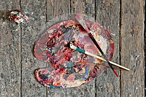 Artist paint brushes and palette