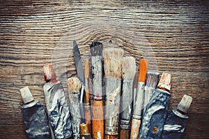 Artist paintbrushes, paint tubes and palette knife closeup.