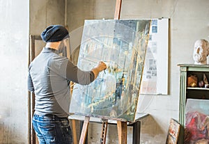 Artist painting on canvas