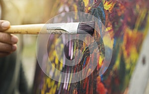 Artist painting colorful on canvas artwork take for skill well