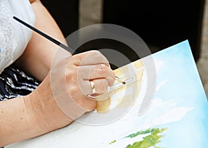 Artist painting hand