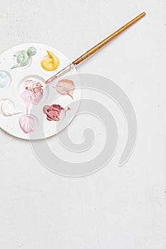 Artist painting palette with brushes. Artistic craft hobby background