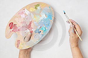 Artist painting palette with brushes. Artistic craft hobby background