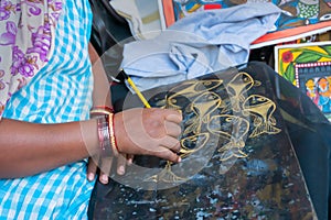 Artist painting Pattachitra or Patachitra - India