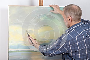 An artist painting in studio