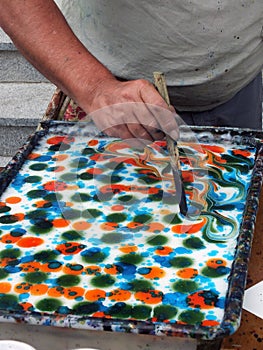 Artist painting with thick brush photo