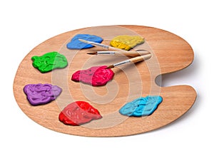 Artist palette with colors and brushes