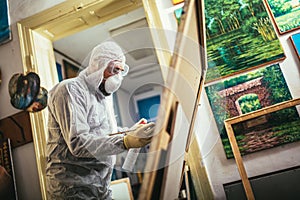 The artist restores the painting