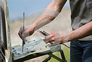 Artist's Hands with Brushes