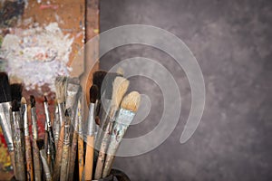 Artist`s palette, brushes, easel