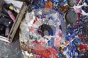 The artist`s palette with pieces of chalk