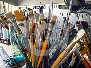 Artist\'s workshop with a paints, tables, easels and stretchers