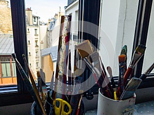 Artist\'s workshop with a paints, tables, easels and stretchers