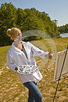 Artist Sizing Up Painting